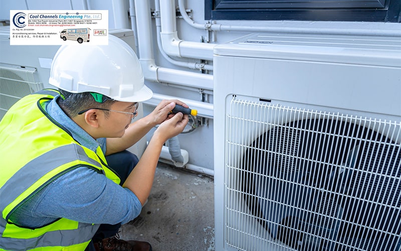 Technician fixing Air conditioner compressor