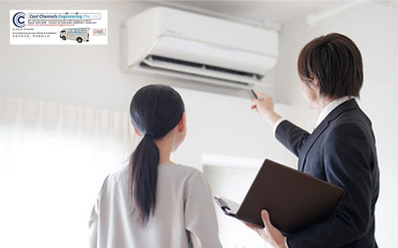 Woman consulting an air conditioner repairer