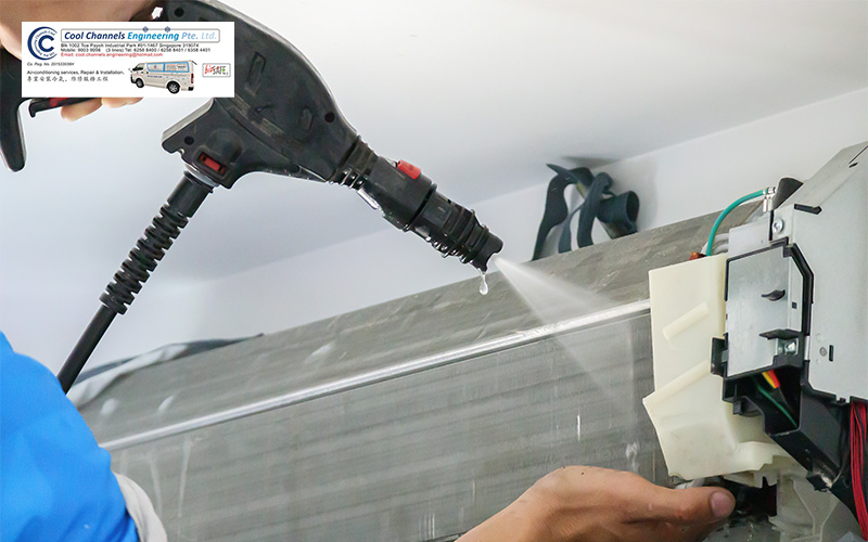 Cool Channels specialist performing a chemical wash on coils.